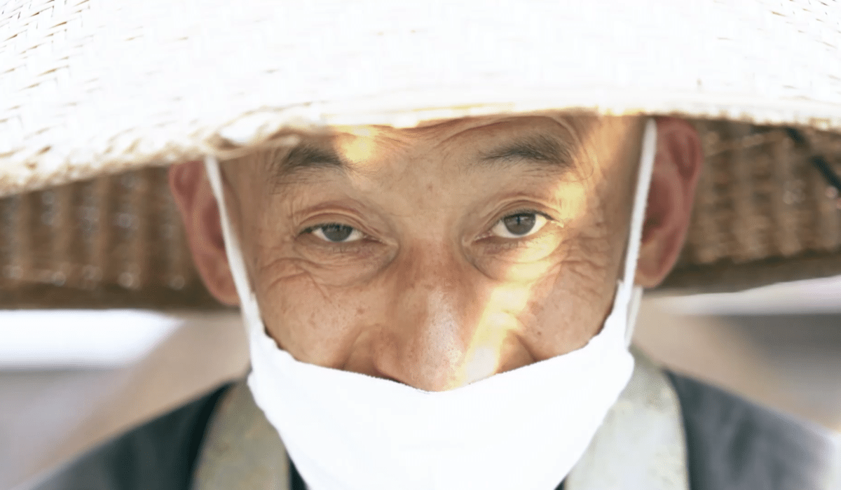 Japanese old man with traditional hat close up eyes wearing mask utah videographers videography 15 questions to ask when hiring a videographer with a Videography Portfolio